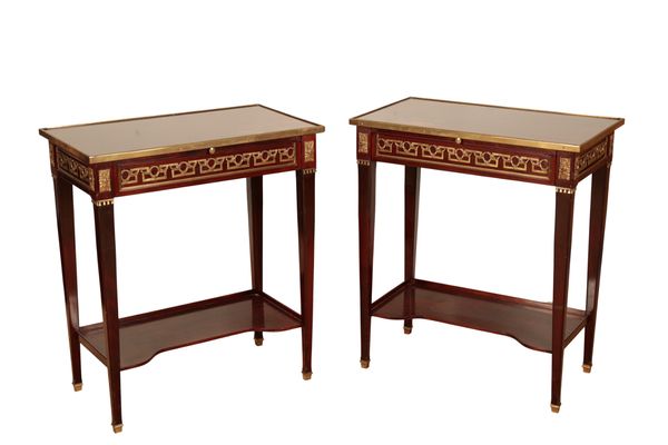 A PAIR OF EMPIRE STYLE MAHOGANY AND GILT METAL MOUNTED SIDE TABLES