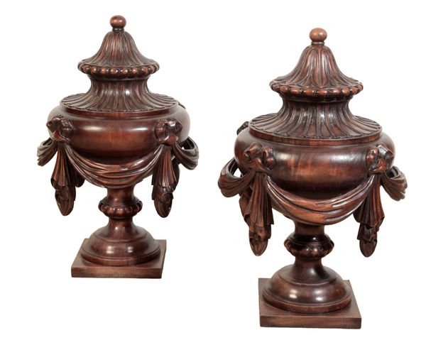 A LARGE PAIR OF CARVED WOOD URNS IN THE MANNER OF ROBERT ADAM
