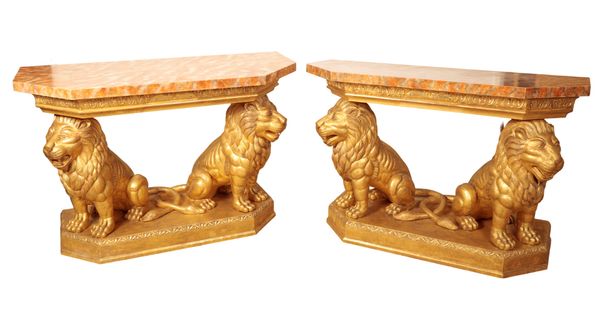 A PAIR OF GILTWOOD LION BASE CONSOLE TABLES