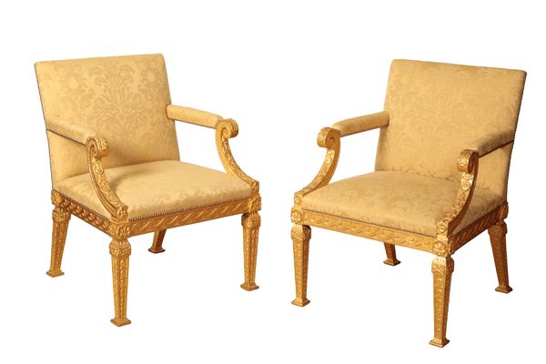 A PAIR OF GILTWOOD ARMCHAIRS AFTER THE SET OF CHAIRS AT ROUSHAM, OXFORDSHIRE