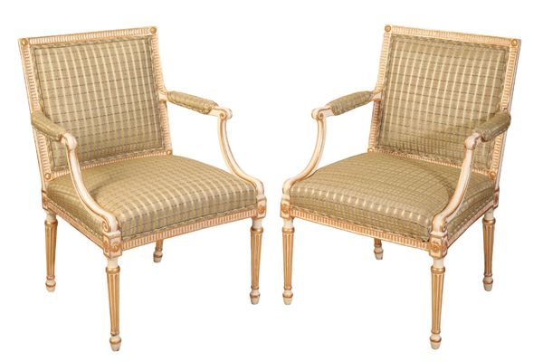 A PAIR OF WHITE-PAINTED AND PARCEL-GILT ARM CHAIRS IN GEORGE III STYLE