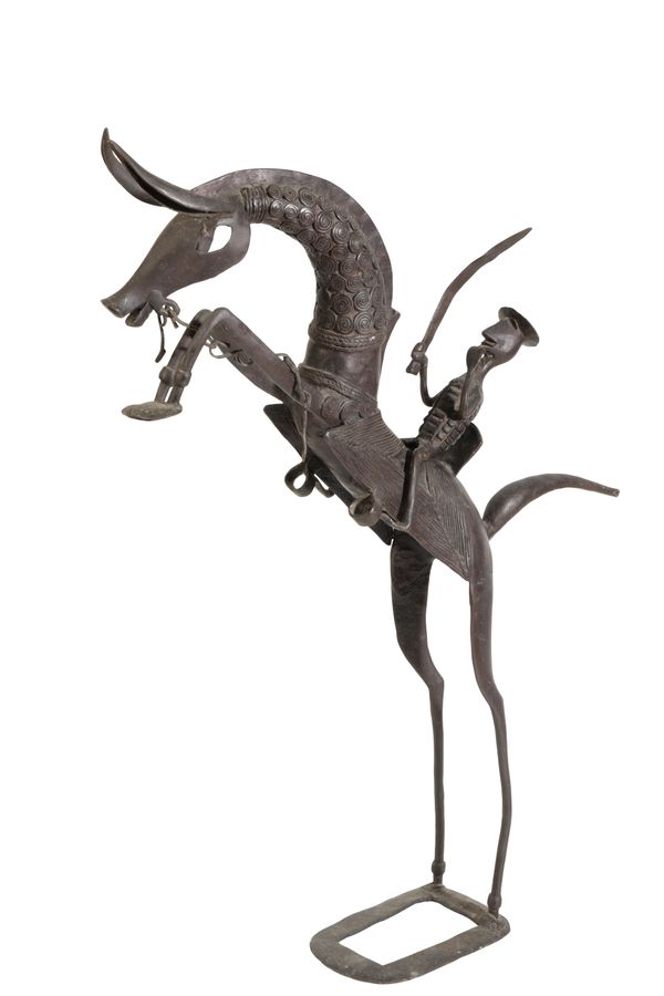 A STYLISED BRONZE FIGURE OF A HORSE AND RIDER