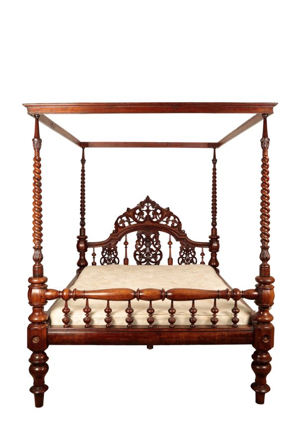 AN ANGLO-INDIAN CARVED HARDWOOD FOUR POSTER BED