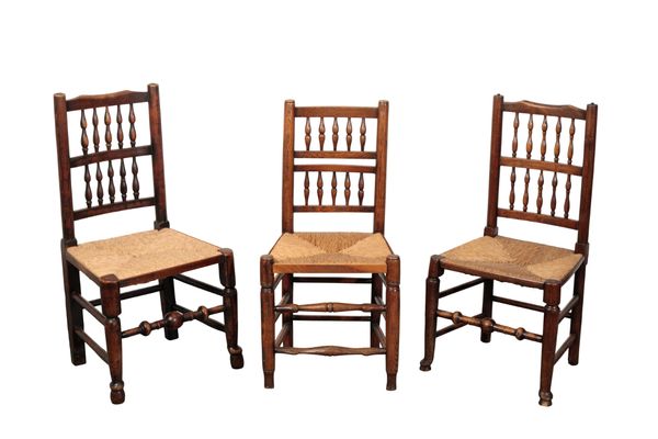 A SET OF SIX OAK SPINDLE BACK CHAIRS