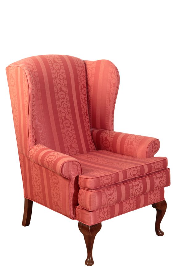 A MAHOGANY WINGBACK ARMCHAIR