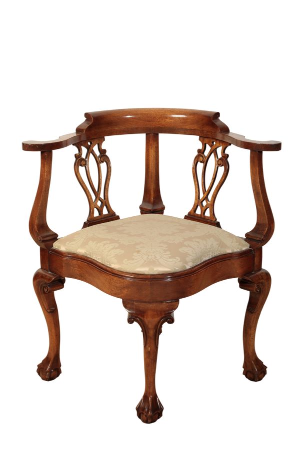 A GEORGE II STYLE CARVED HARDWOOD CORNER CHAIR