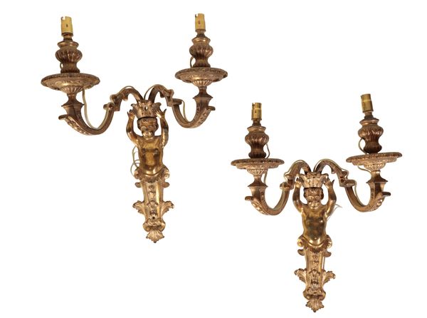 A PAIR OF GILT METAL TWIN LIGHT WALL APPLIQUES