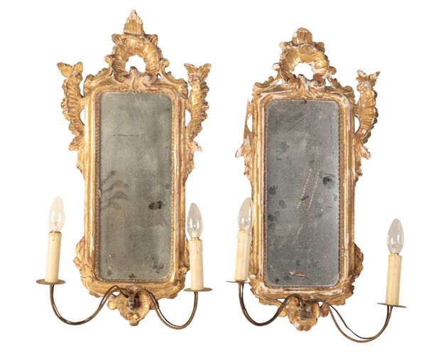 A PAIR OF ITALIAN CARVED AND GILTWOOD GIRANDOLE WALL MIRRORS