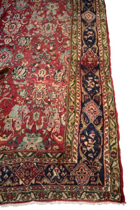 A RED GROUND NORTH WEST PERSIAN CARPET