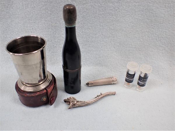 A NOVELTY PIPE IN THE SHAPE OF A CHAMPAGNE BOTTLE, AN OPIUM PIPE