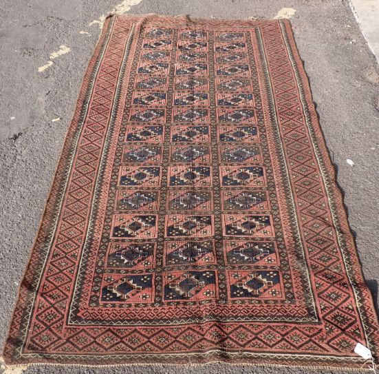 RED GROUND PERSIAN STYLE RUNNER WITH GEOMETRIC PATTERN