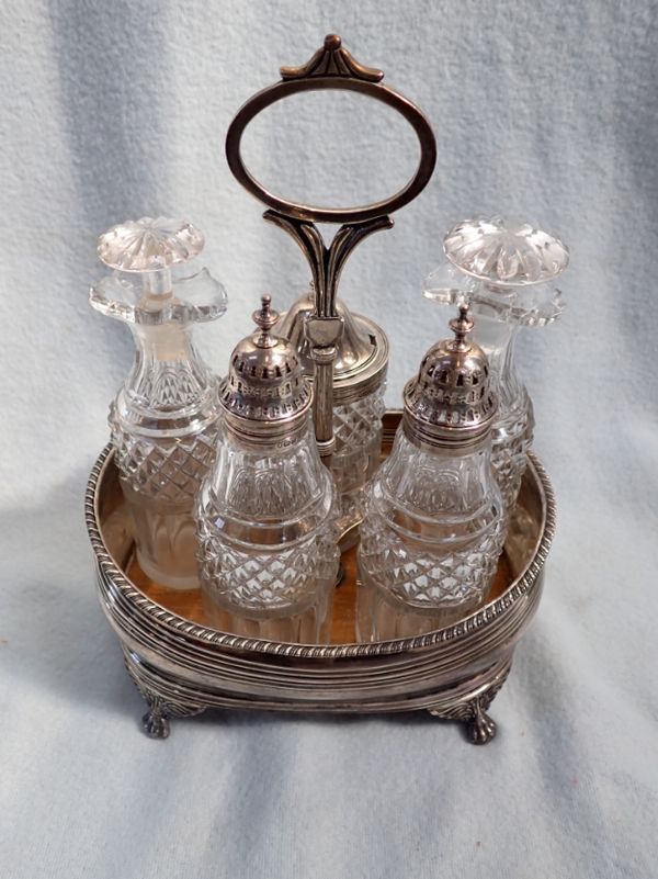 A GEORGIAN SILVER AND PLATED FIVE-BOTTLE CRUET