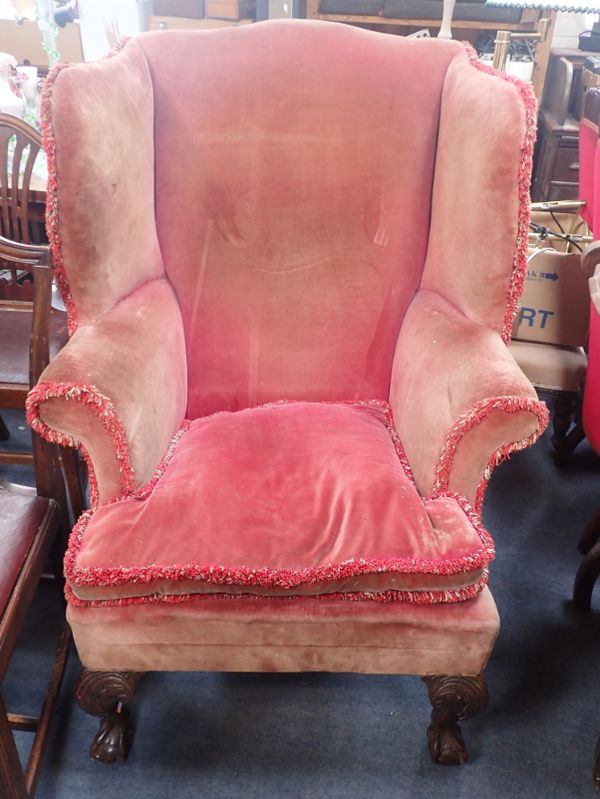 A GEORGE II STYLE WING ARMCHAIR, WITH CARVED CABRIOLE FRONT LEGS