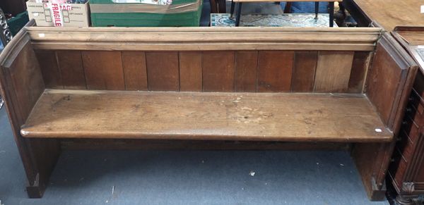 AN OAK CHURCH PEW, WITH SQUARE ENDS