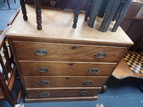 A HARDWOOD CHEST OF DRAWERS