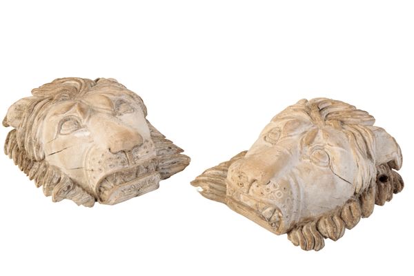 A PAIR OF LIMED WOOD LIONS MASKS