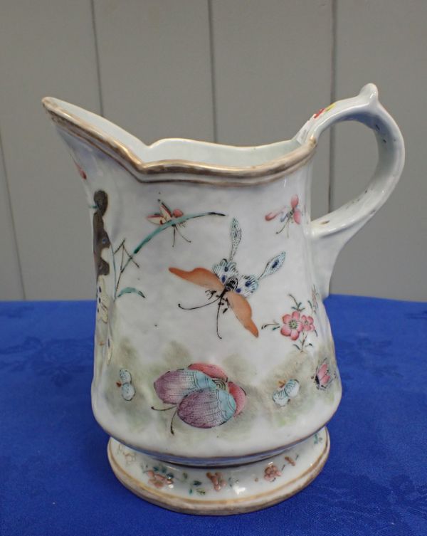 A CHINESE EXPORT JUG PAINTED WITH INSECTS AND BUTTERFLIES