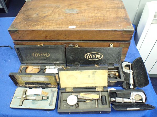 A WOODEN BOX CONTAINING  CALIBRATING INSTRUMENTS