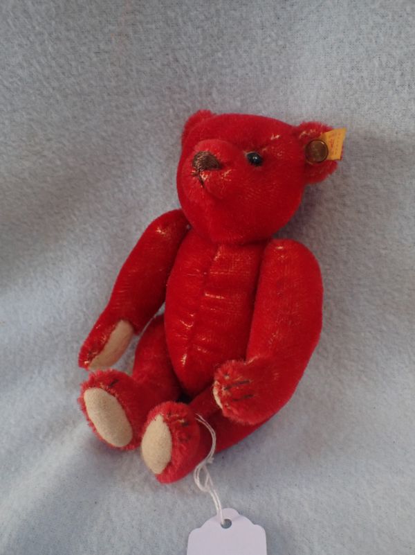 A MODERN STEIFF RED PLUSH TEDDY BEAR