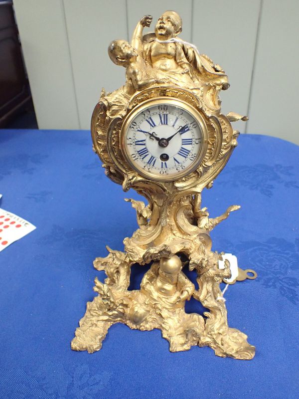 A FRENCH LOUIS XV STYLE ORMOLU CLOCK