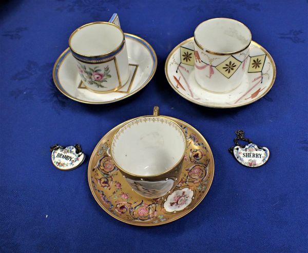 A FRENCH GILDED AND PAINTED CABINET CUP AND SAUCER