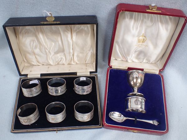 A CASED SET OF SIX ENGINE-TURNED SILVER NAPKIN RINGS