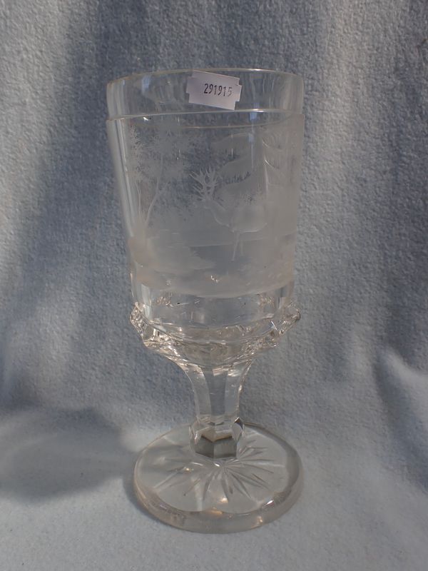 A GLASS GOBLET ETCHED WITH A WOODLAND SCENE