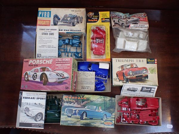 A COLLECTION OF UN-MADE KIT FORM MODEL VEHICLES