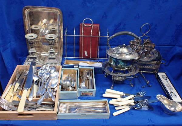 A PAIR OF SILVER-PLATED CANDLESTICKS