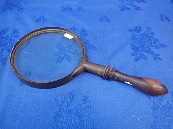 A LARGE MAGNIFYING GLASS