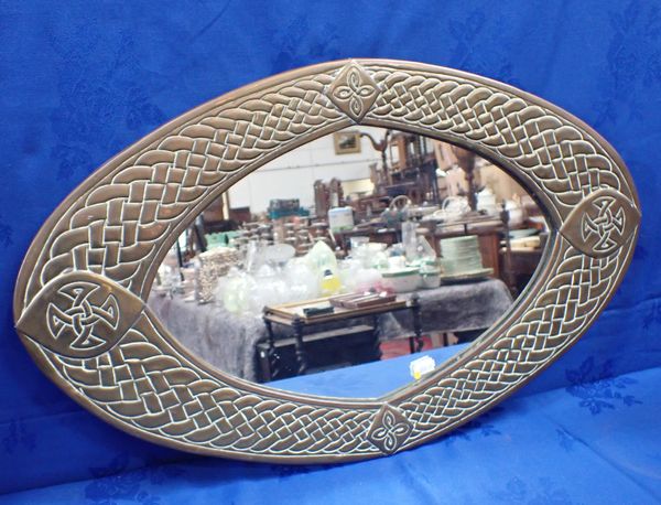 AN ARTS AND CRAFTS STYLE BRASS FRAMED MIRROR