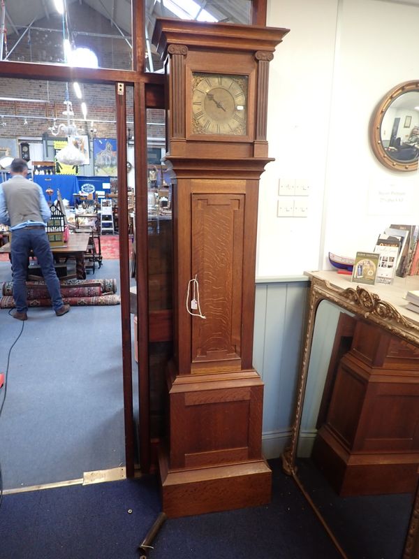 AN OAK LONGCASE CLOCK