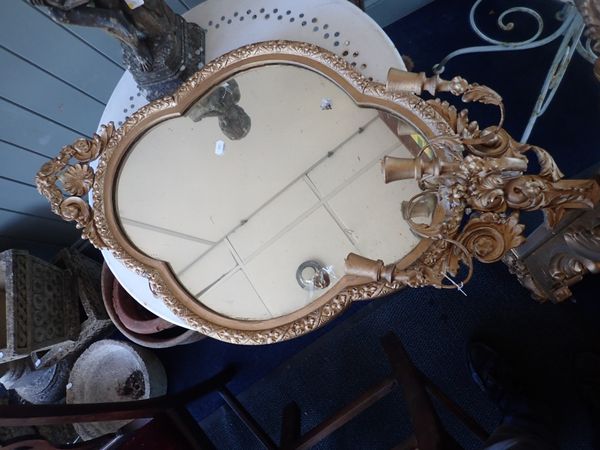 A GILTWOOD AND COMPOSITION GIRANDOLE MIRROR