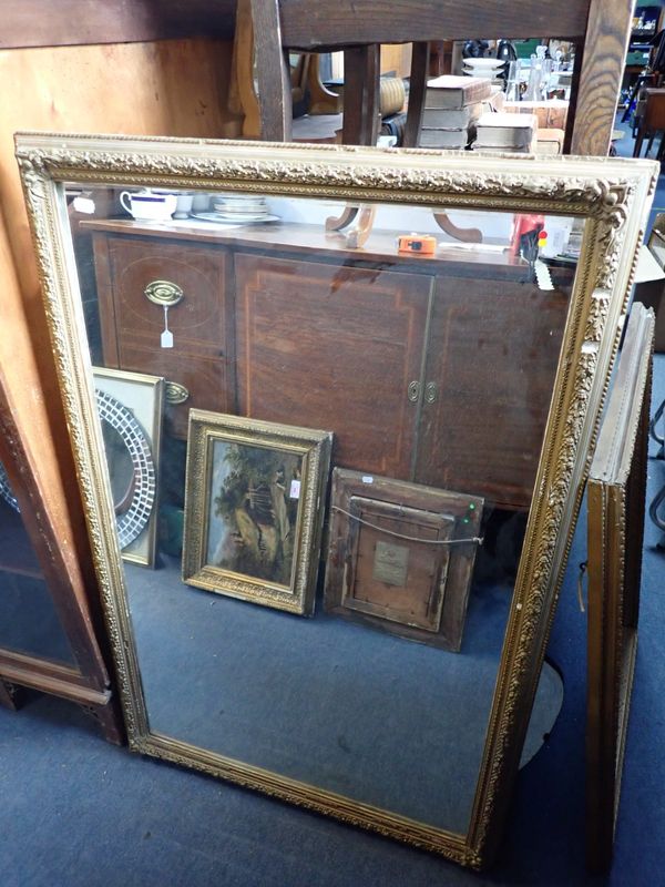 A GILTWOOD AND COMPOSITION MIRROR