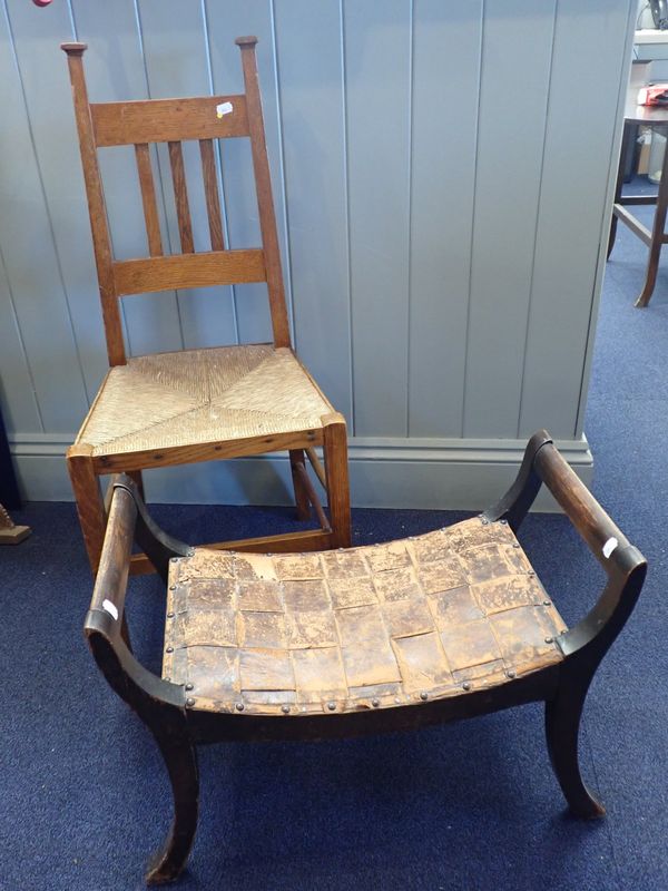 AN OAK ARTS AND CRAFTS INTERLACED LEATHER TOPPED STOOL