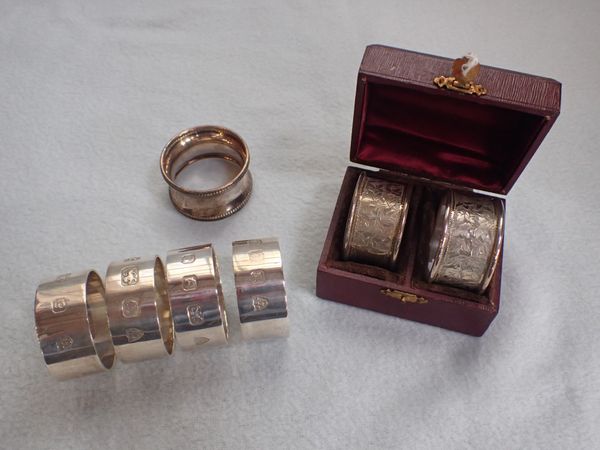 FOUR MODERN HEAVY-GAUGE SILVER NAPKIN RINGS