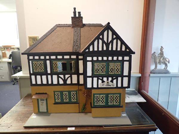 A 1930S TRI-ANG DOLL'S HOUSE