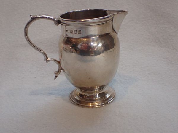 A LONDON SILVER CREAM JUG