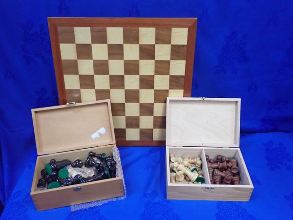 TWO BOXED CHESS SETS AND A BOARD