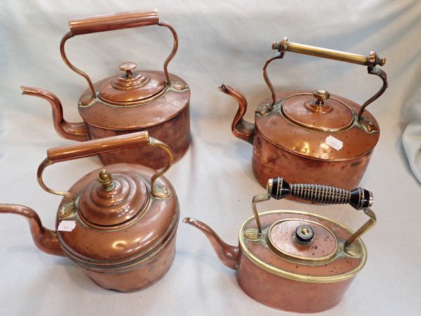 A COPPER AND BRASS KETTLE WITH TURNED HANDLE