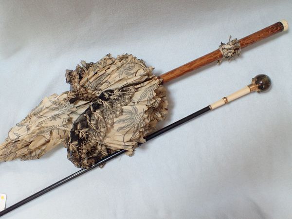 A 19TH CENTURY LONG WALKING STICK WITH STONE FINIAL