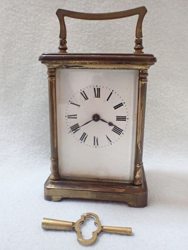 A BRASS-CASED CARRIAGE CLOCK