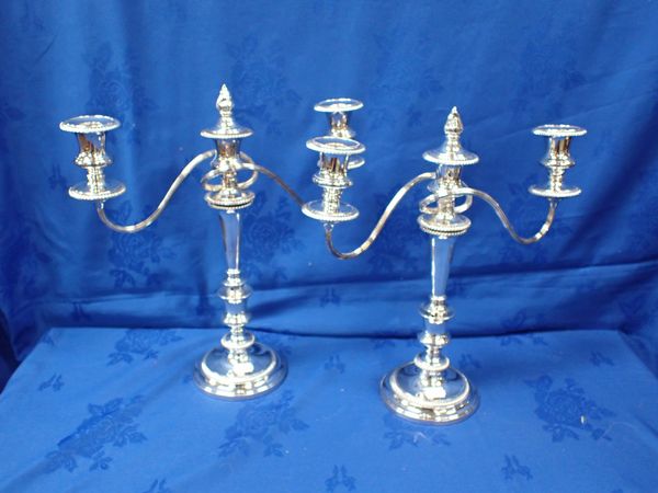 A PAIR OF THREE BRANCHED SILVER PLATED CANDLEABRA