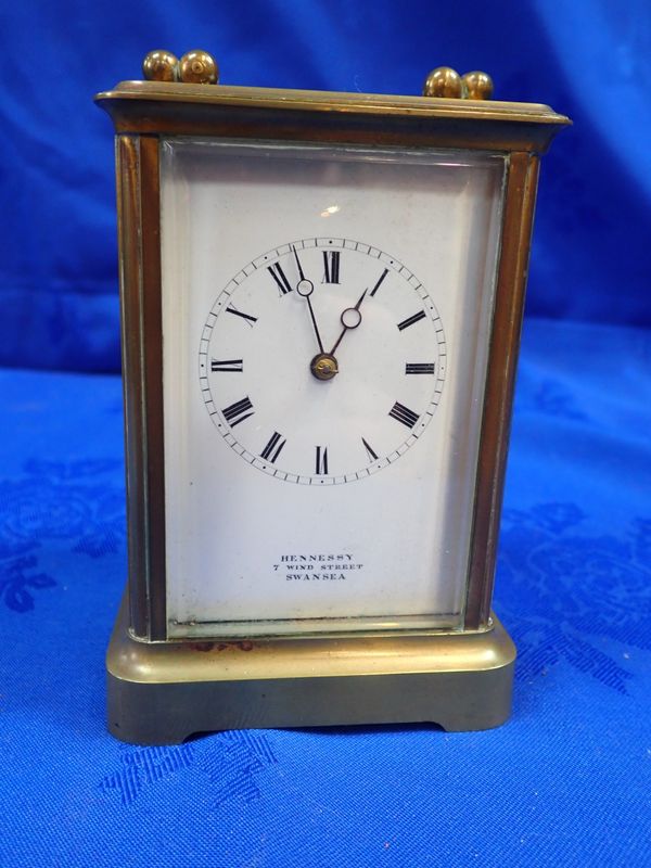 A BRASS-CASED CARRIAGE CLOCK BY HENNESSY OF SWANSEA