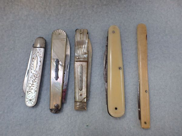 THREE SILVER AND MOTHER-OF-PEARL POCKET KNIVES AND TWO SIMILAR