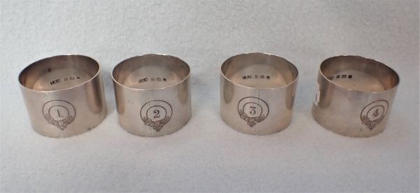 FOUR SILVER NAPKIN RINGS