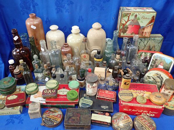 A COLLECTION OF VINTAGE BOTTLES AND TINS