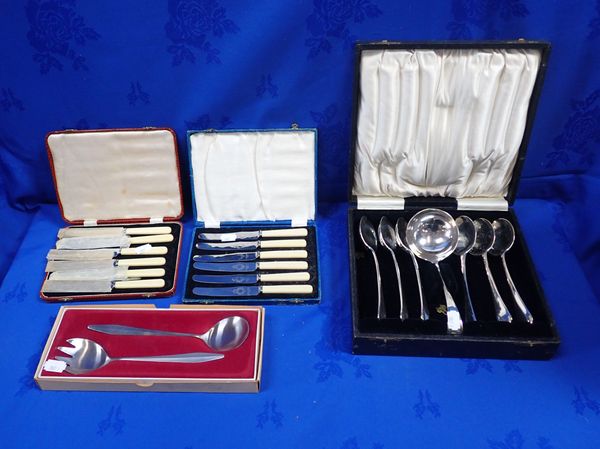 A CASED SET OF SILVER-PLATED SOUP SPOONS  AND LADLE