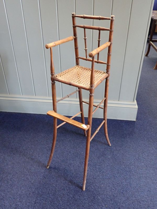 A REGENCY BABY'S OR DOLL'S  FAUX-BAMBOO HIGH CHAIR, OF DELICATE PROPORTIONS