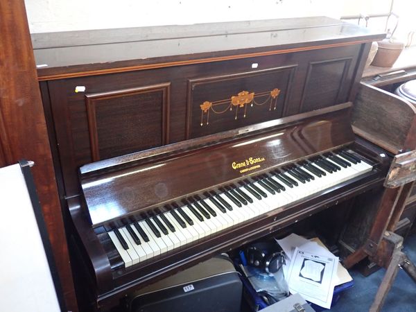 AN OVERSTRUNG UPRIGHT PIANO